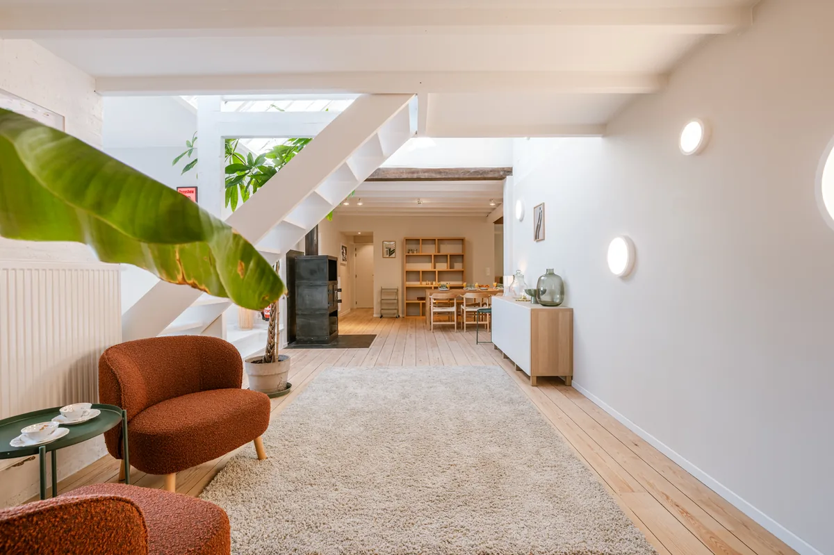 Casa Miro — spacious living area with wood stove and glass roof